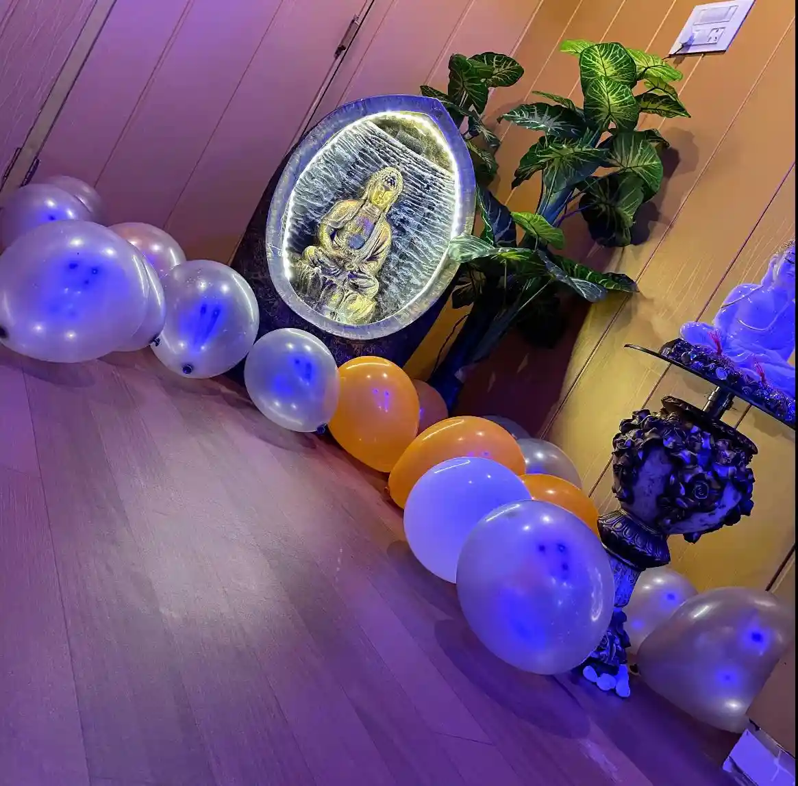 decoration inside swan spa with balloons and budhdha idol